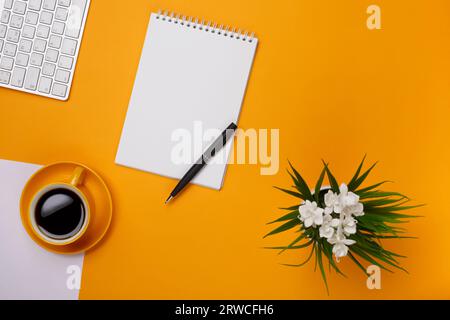 Workflow with morning coffee keyboard and notepad for notes and pen Stock Photo