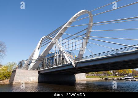 Lazarevsky Bridge on a sunny day. A cable-stayed bridge located in St. Petersburg, Russia. It crosses the Little Nevka River, connecting Krestovsky Is Stock Photo