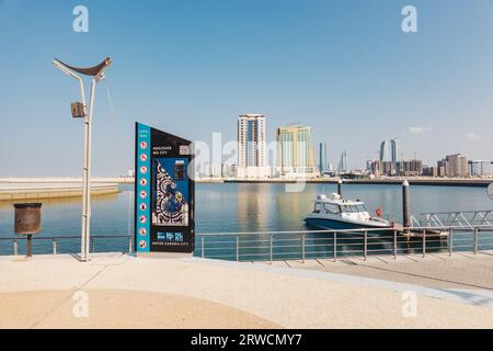 a boat moored at Water Garden City, a marina on a man-made bay with restaurants and apartments in Manama, Bahrain Stock Photo