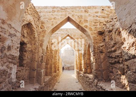 stone archways in Qal'at al-Bahrain, a fort dating back to 2300 BCE, abandoned by the Portuguese in the 16th century, in Bahrain Stock Photo