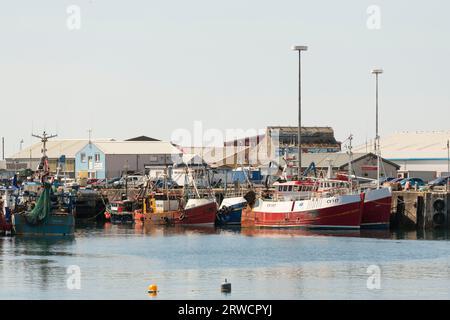 Fishing Boats Moored Alongside the Pier at Mallaig Harbour in Summer Stock Photo