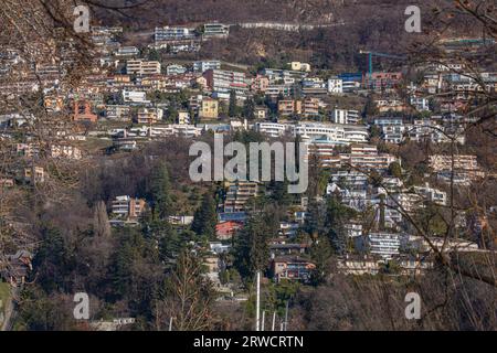 Lugano Switzerland, 21 January 2023: High angle town view from Lake Lugano, Switzerland. Stock Photo