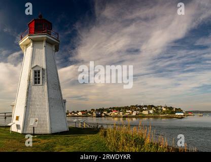 Mulholland Point navigation light and Town of Lubec, Maine   Welshpool, Campobello Island, New Brunswick, CA Stock Photo