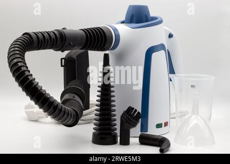 Hand-held steam clear set isolated on white background. Stock Photo