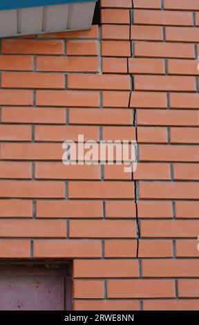 Brick house wall crack. Repair brick wall damage. Stock Photo