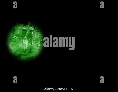 Night vision, military and target scope of a army outdoor with security at war with green light. Search, surveillance and government with scope and Stock Photo