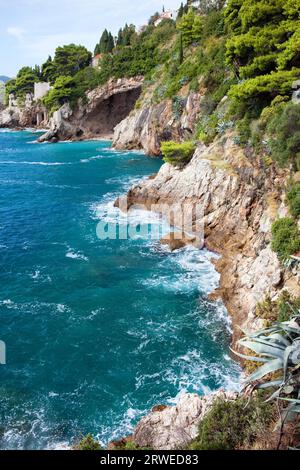 Cliffs on the Adriatic Sea scenic coastline near Dubrovnik in Southern Croatia, Dalmatia region Stock Photo
