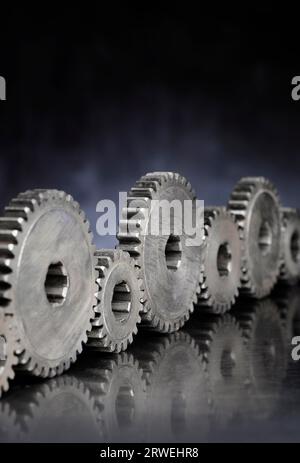 Old metallic cog gears in a row Stock Photo