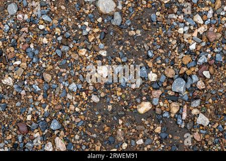 Gray small rocks ground texture. Black small road stone background. gravel pebbles stone texture Stock Photo