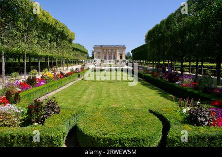 Stunning gardens in front of Le Petit Trianon at The Palace of Versailles. Versailles, France Stock Photo