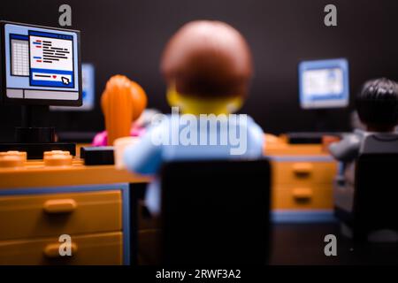 White-collar workers in front of their computers, open space Stock Photo