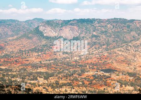 Aerial view of rural African Landscape with rock formations against valley and mountains in Makunei County, Kenya Stock Photo