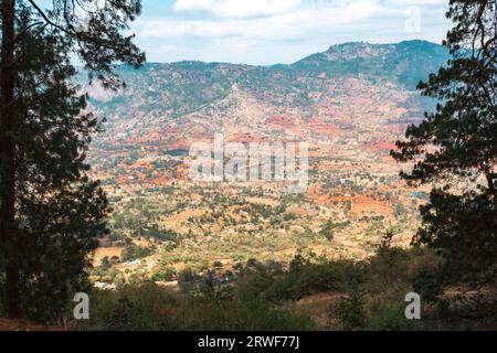 Aerial view of rural African Landscape with rock formations against valley and mountains in Makunei County, Kenya Stock Photo