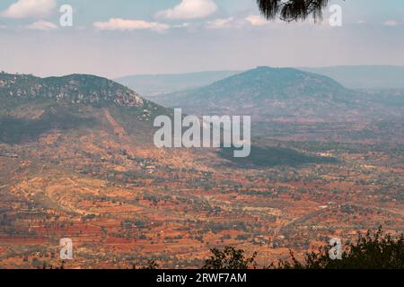 Aerial view of rural African Landscape with rock formations against valley and mountains in Makunei County, Kenya Stock Photo