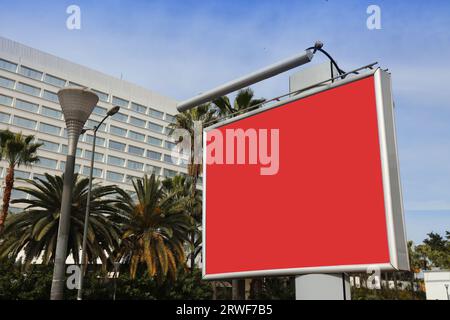 Large billboard sign - blank space. Empty red advertisement with copy space in a big city. Stock Photo