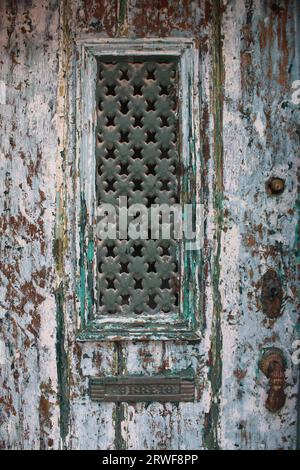 A Vintage looking Front Door with Distressed Paintwork. Stock Photo