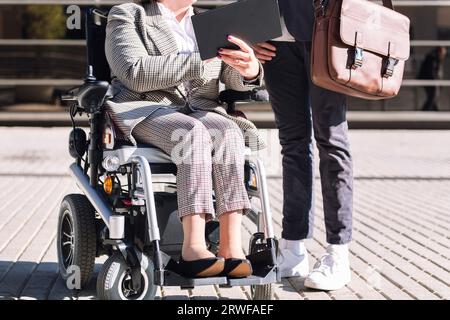 business man and woman using wheelchair Stock Photo