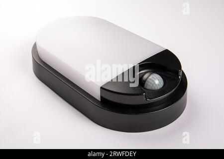 Outdoor led lamp with a motion sensor on a white background. Close up. Stock Photo