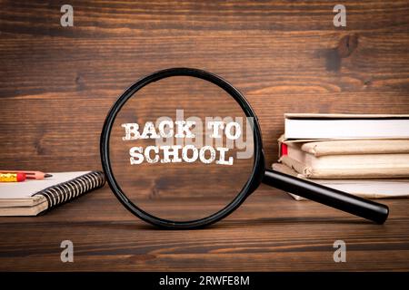 Back To School Concept. Textbooks on a wooden texture table. Stock Photo