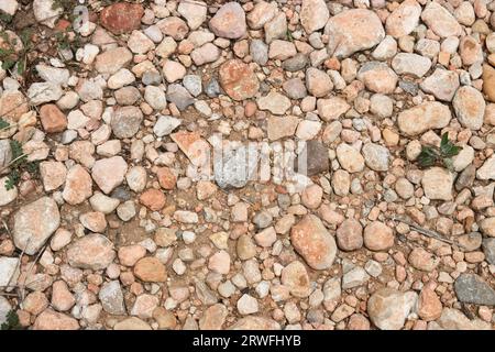 Image of some stones and gravel that form the soil of a rural road that serves as backgrounds for rustic themes Stock Photo