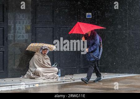 Preston, Lancashire.  UK Weather Sept 2023. Shops, shoppers shopping on a gusty windy day with heavy showers in Preston. Remaining windy, with gales locally in the west. Spells of heavy and persistent rain are expected this afternoon.   Credit. MediaWorldImages/AlamyLiveNews Stock Photo