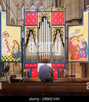 The St Teilo organ, a modern replica of a tudor organ, in the chancel of the norman built medieval cathedral at Lincoln, England, September 2023. Stock Photo