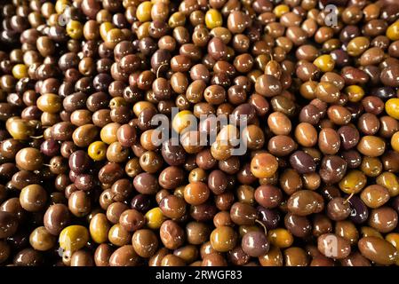 Freshly marinated olives at the market. Stock Photo
