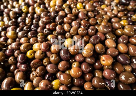 Freshly marinated olives at the market. Stock Photo