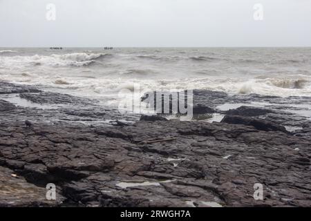 Rocky beach along the Arabian sea coast, Bandstand Promenade in Bandra, Mumbai. Stock Photo