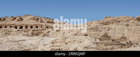 View of saff row tombs from Qurnet Murai on the West Bank of the River Nile at Luxor, Upper Egypt Stock Photo