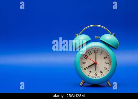 time concept with blue clock on blue background Stock Photo