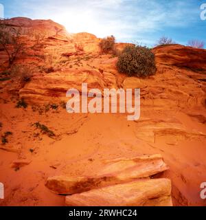 Sun setting behind rock formations in Valley of Fire State Park in Nevada Stock Photo