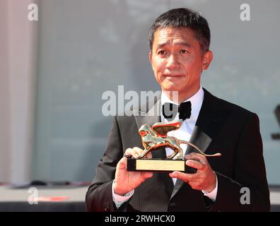 VENICE, ITALY - SEPTEMBER 02: Tony Leung attends a red carpet for the Golden Lion For Lifetime Achievement at the 80th Venice Film Festival Stock Photo