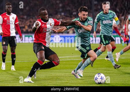 Rotterdam, Netherlands. 19th Sep, 2023. ROTTERDAM, NETHERLANDS - SEPTEMBER 19: Lutsharel Geertruida of Feyenoord battles for possession with Greg Taylor of Celtic during the UEFA Champions League Group E match between Feyenoord and Celtic at Stadion Feyenoord on September 19, 2023 in Rotterdam, Netherlands. (Photo by Andre Weening/Orange Pictures) Credit: Orange Pics BV/Alamy Live News Stock Photo