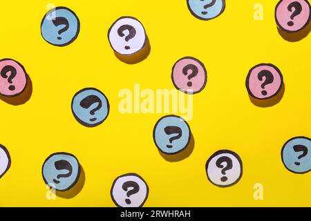 Different question marks on yellow background Stock Photo