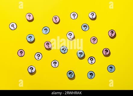 Different question marks on yellow background Stock Photo