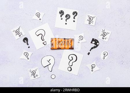 Quiz card with different question marks on white background Stock Photo