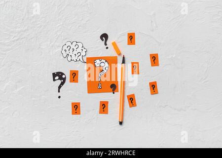 Quiz card with bubble speech and different question marks on white background Stock Photo