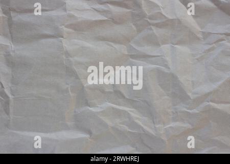 Craft paper texture, brown packaging background. Beige packaging, vintage page. Sheet for creativity, natural papyrus pattern. Stock Photo