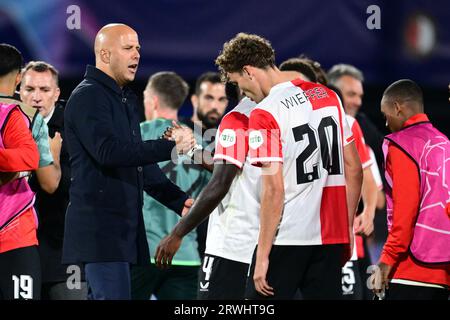 ROTTERDAM - (l-r) Feyenoord coach Arne Slot, Lutsharel Geertruida of Feyenoord during the UEFA Champions League match between Feyenoord and Celtic FC at Feyenoord Stadium de Kuip on September 19, 2023 in Rotterdam, Netherlands. ANP OLAF KRAAK Stock Photo