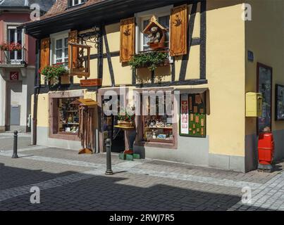 Alsace, France - August 14th 2017 - Cute children's toy shop in a Alsatian village with shutters and a toy bear outside Stock Photo