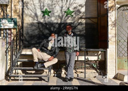 Two friendly local men posing for photo in Maaloula, an Aramaic-speaking Christian town built on rugged mountains in Syria Stock Photo