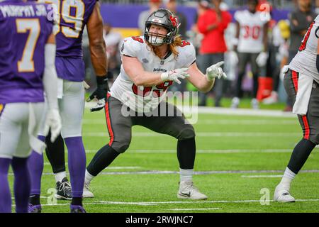 Chicago Bears defensive tackle Justin Jones (93) is held back by Tampa Bay  Buccaneers guard Cody Mauch (69) as Jones tries to stop a pass by Tampa Bay  Buccaneers quarterback Baker Mayfield (