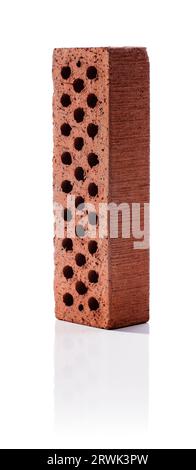 Perforated brick on white reflecting background Stock Photo
