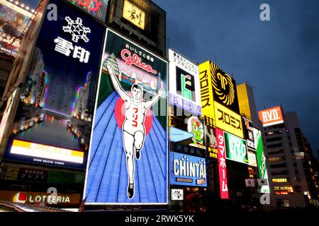 The Glico Running Man over the Dotonbori canal Stock Photo