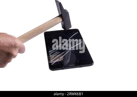 a small tablet with a broken screen on a transparent surface Stock Photo