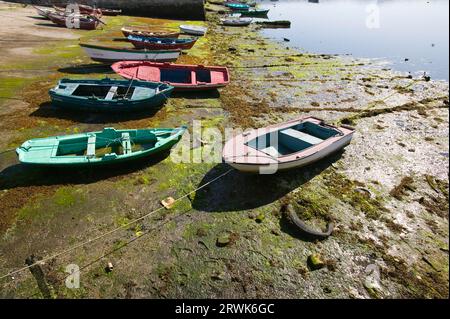 Dinghies ashore during low tide Stock Photo