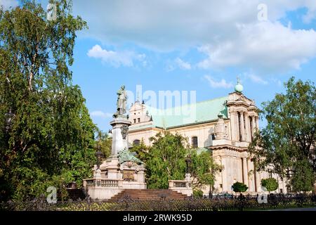 17th century Roman Catholic Carmelite Church and Adam Mickiewicz Polish Romantic poet statue in Warsaw, Poland Stock Photo