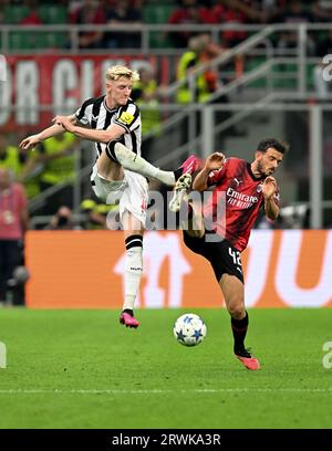 Milan, Italy. 19th Sep, 2023. AC Milan's Alessandro Florenzi (R) vies with Newcastle United's Anthony Gordon during their UEFA Champions League Group F match in Milan, Italy, on Sept. 19, 2023. Credit: Str/Xinhua/Alamy Live News Stock Photo