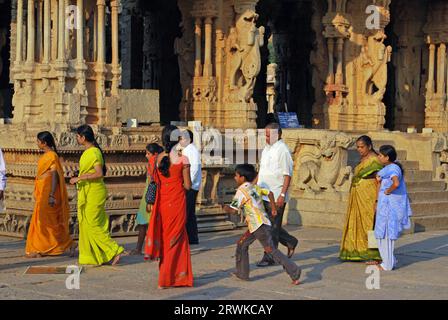 Indian woman, men and children at the Vitthala Temple in Hampi, South India Stock Photo